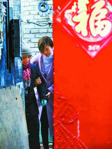 “90”后志愿者宋红妮和九道湾社区很多老街坊都亲如一家。